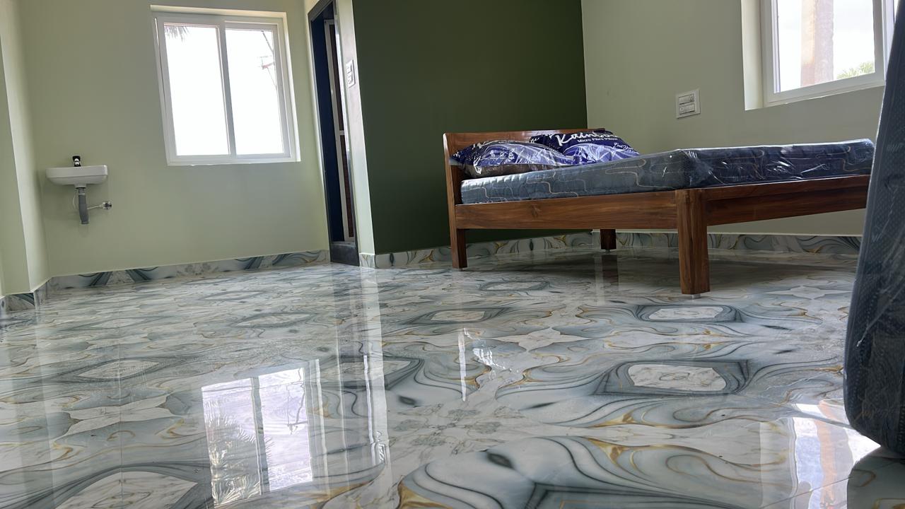Blue accent luxury AC room for wedding guests at Surabhi SJN