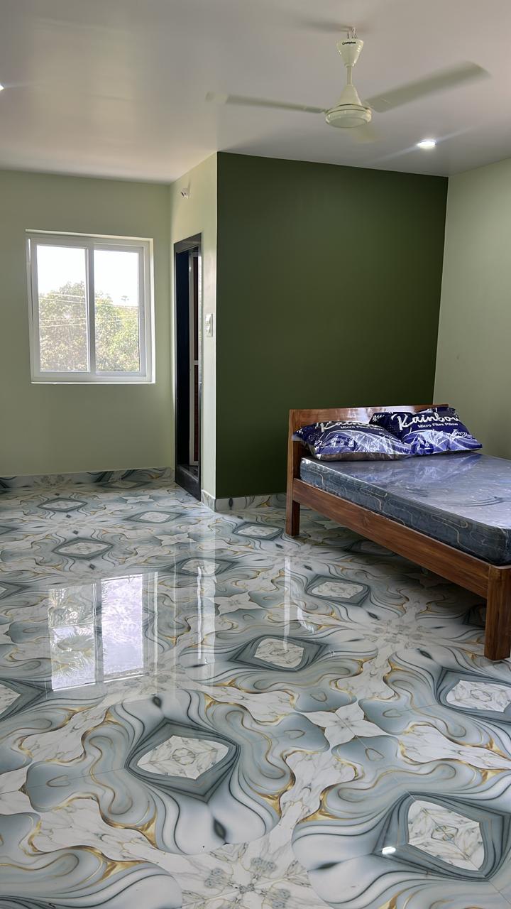 Blue patterned floor guest room with AC at Surabhi SJN