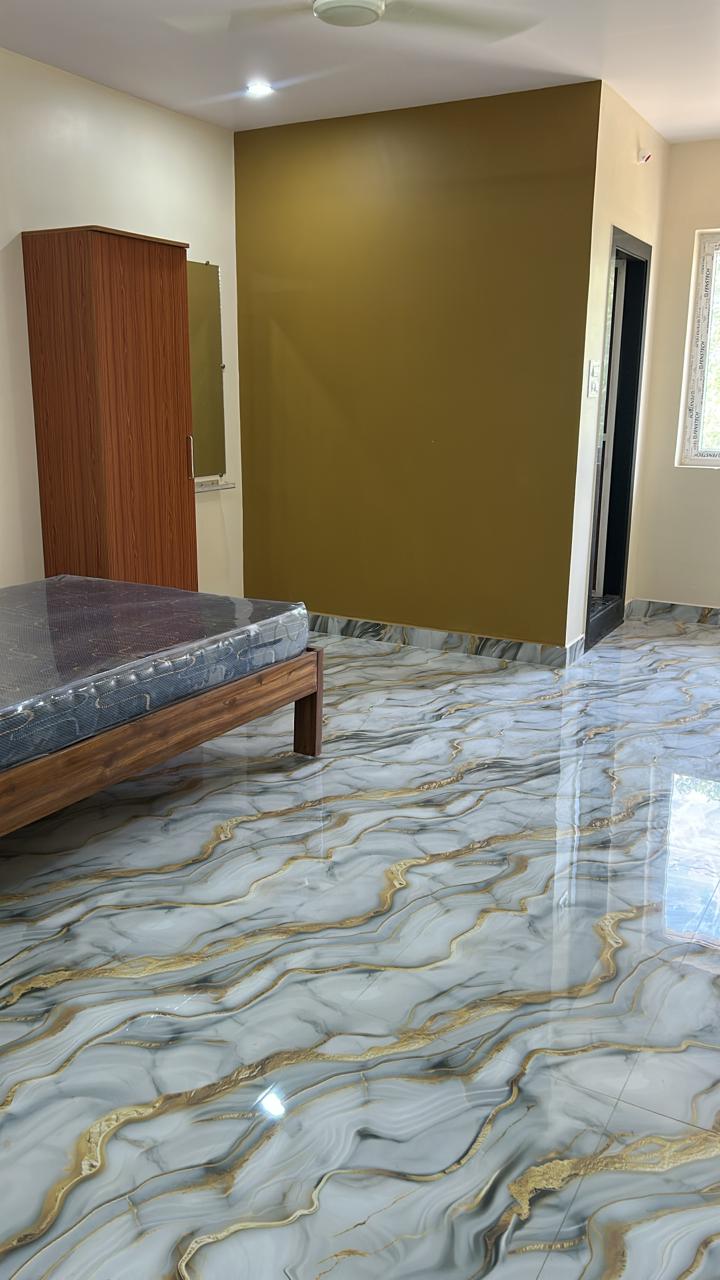 Open guest room floor area with window and attached door