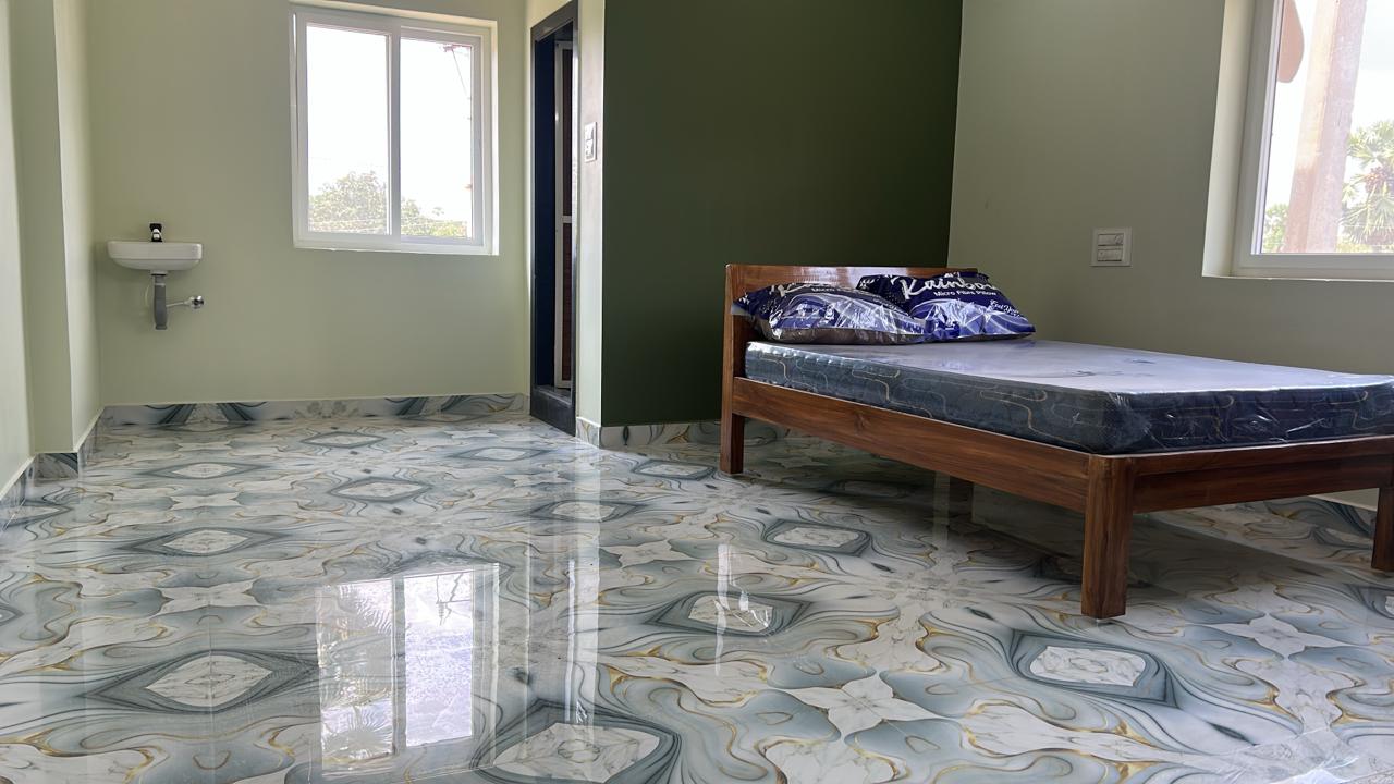 Grey and purple luxury AC room with glossy floor at Surabhi SJN