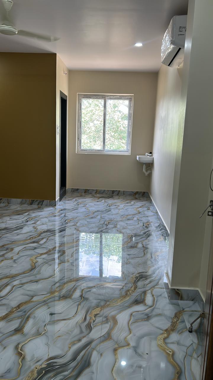Guest room with wardrobe, bed, and glossy floor