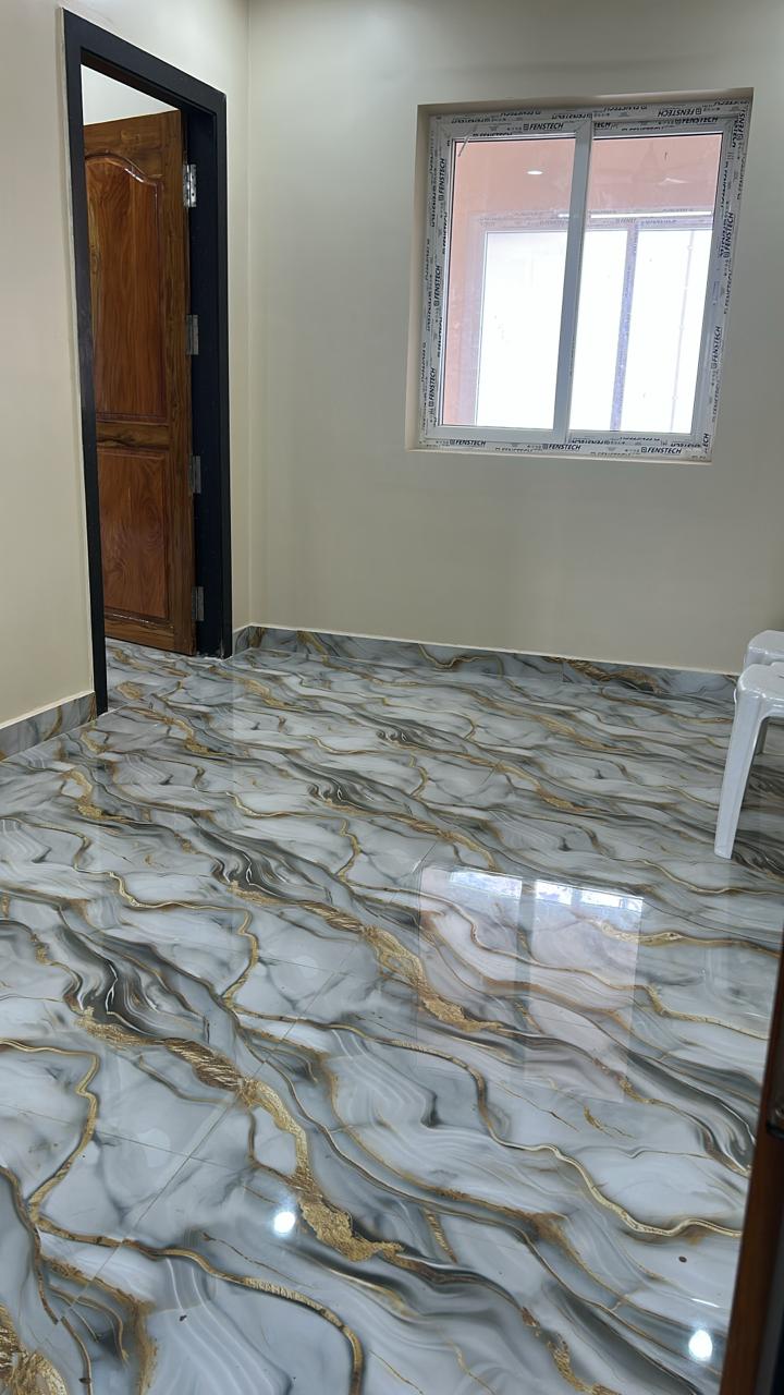 Guest room wash area with window and polished black floor