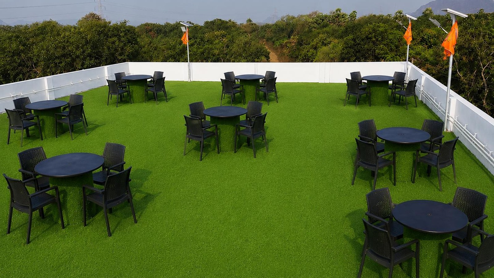 Rooftop garden with seating tables at Surabhi SJN Convention Hall near Rajahmundry